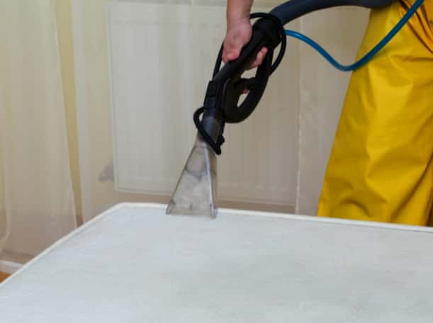This is a photo of a man steam cleaning a dirty mattress works carried out by This is a photo of an empty room with cream carpets works carried out by St Paul's Cray Carpet Cleaning