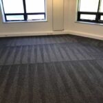 This is a photo of a grey office carpet that has just been professionally steam cleaned works carried out by St Paul's Cray Carpet Cleaning