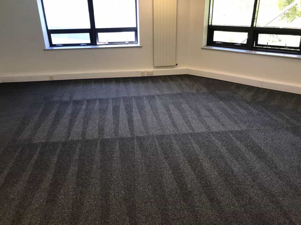 This is a photo of a grey office carpet that has just been professionally steam cleaned works carried out by St Paul's Cray Carpet Cleaning